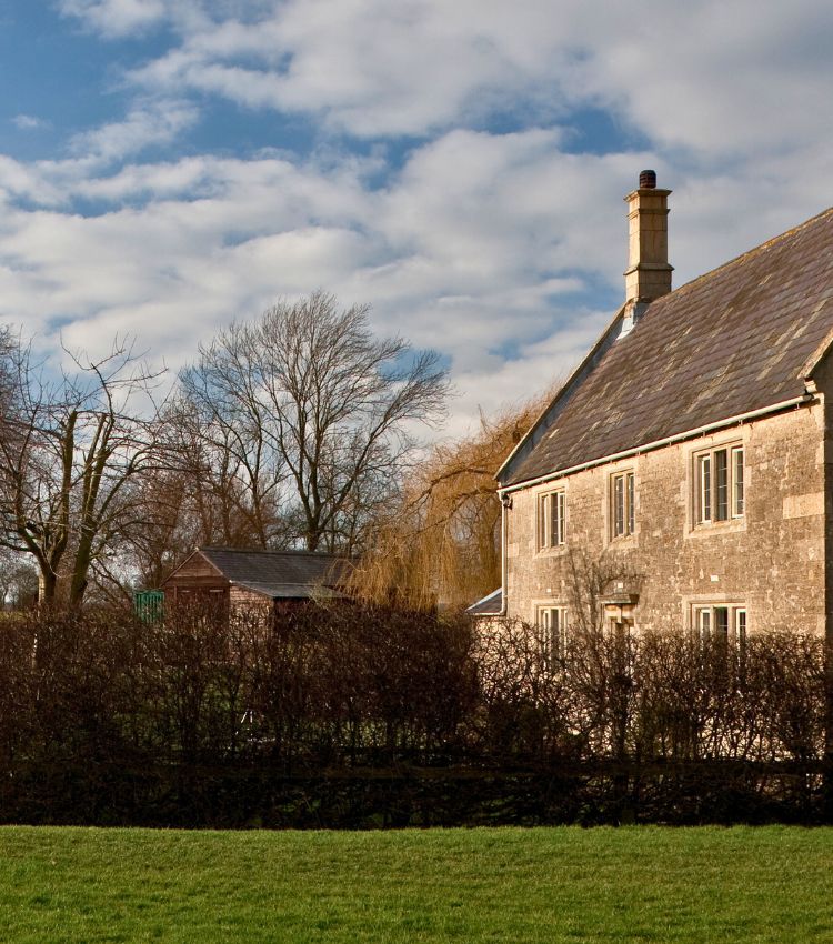 Old English cottage situated in rural countryside